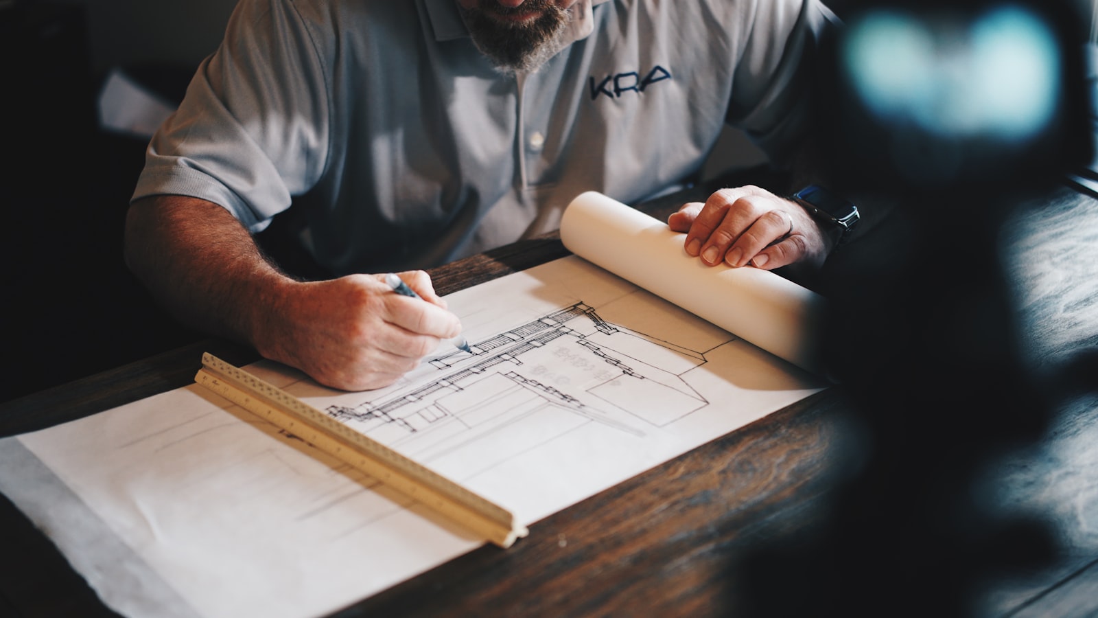 Construction plans and layout work on a project table